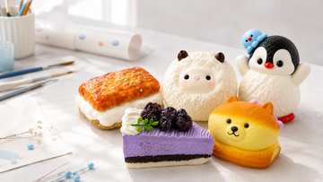 Assorted cake and toast food squishies arranged to compare handmade silicone textures